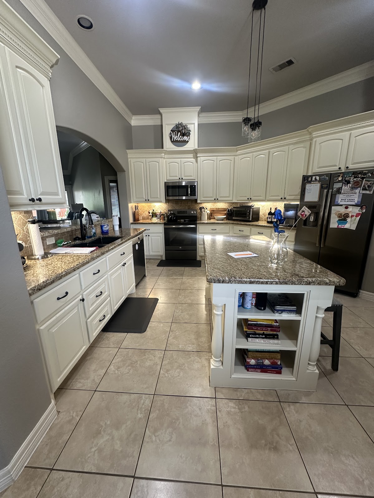 Kitchen after - freshly painted white cabinets