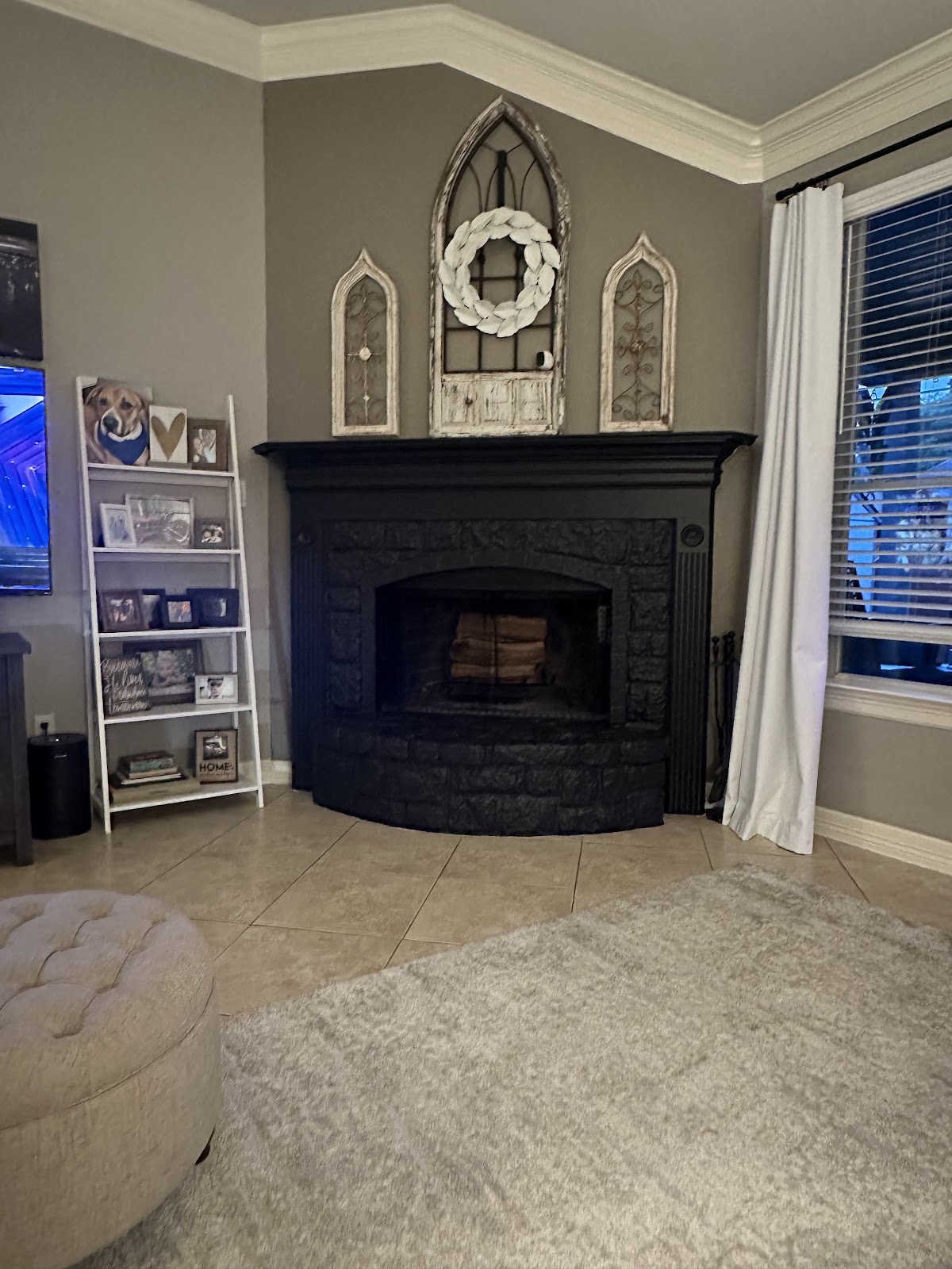 Fireplace with painted accent wall in warm grey